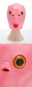 Pink fish head latex mask detail shot showing realistic skin texture and large protruding eye.