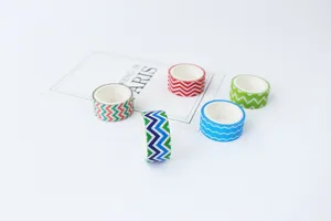 Detailed shot of colorful chevron washi tape rolls for DIY journal decoration and crafts.