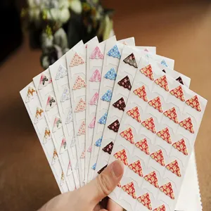 Floral photo corner stickers detail shot, perfect for DIY photo walls and scrapbooking decor.