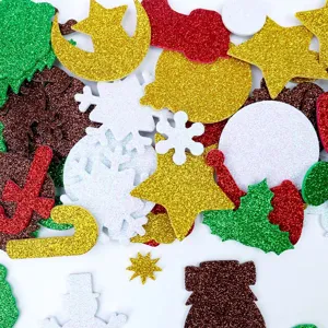 Close-up detail shot of colorful glitter EVA foam Christmas stickers, showing various shapes.