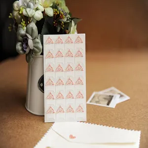 Detail view of floral photo corner stickers, ideal for DIY scrapbooking and photo album mounting.