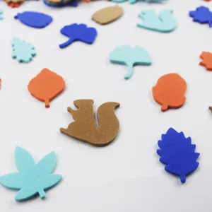 Close-up detail of colorful EVA foam autumn leaf and squirrel stickers, perfect for crafts.
