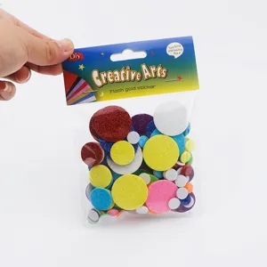 Close-up of colorful round EVA foam stickers with self-adhesive backing in a clear packaging bag.
