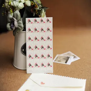 Detailed shot of floral photo mounting corner stickers, perfect for DIY scrapbooks and albums.