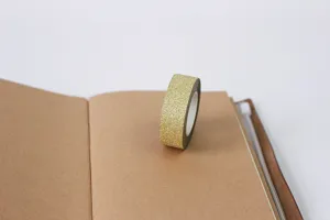 Gold glitter washi tape detail shot, perfect for DIY journaling, scrapbooking, and album decoration.