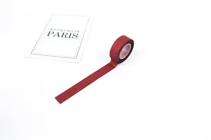 Red glitter washi tape for DIY crafts, scrapbooking, and decorative journaling projects.