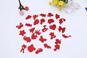 Close-up view of assorted red glitter EVA foam sticker shapes, showing sparkling texture and details.