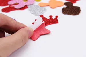 EVA glitter foam stickers detail shot showing peeling backing paper for kids crafts and DIY.