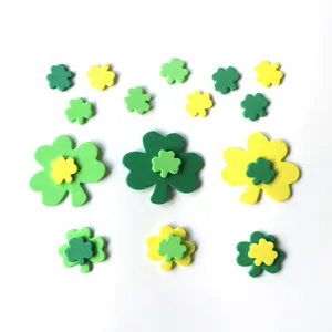 Green and yellow foam shamrock stickers detail view for St. Patrick's Day party decoration craft.