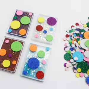 Glitter foam circle stickers detail view, colorful DIY adhesive dots for crafts and cards.