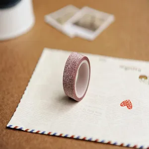 Pink glitter washi tape for DIY scrapbooking, decorative adhesive masking tape for photo albums.
