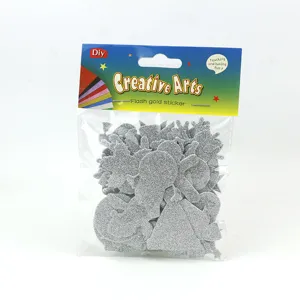 Detailed view of DIY silver glitter EVA foam stickers in hanging packaging, Christmas themes.