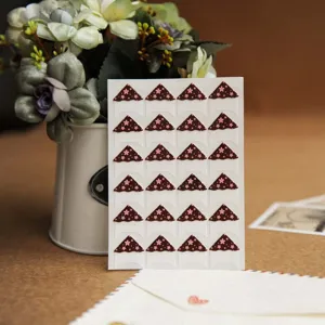 Floral photo corner stickers, 24 pieces per sheet, perfect for scrapbooking and photo walls.