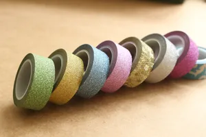 Glitter washi tape set details showcasing colorful sparkle adhesive masking tapes for crafts.