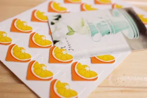 Cute orange slice photo corners for DIY scrapbooking, photo albums and paper crafts decoration.