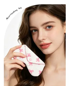 Handcrafted fabric quilted glasses case with cute pink bows and heart snap closure for daily use.