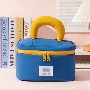 Portable makeup bag with blue and yellow color block design, large capacity storage pouch.