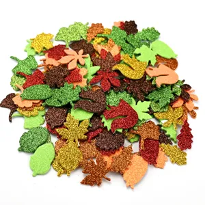 Detailed close-up of colorful glitter EVA foam autumn leaves and cute squirrel stickers.