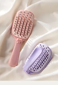 Portable foldable hair brush for scalp massage and fluffy hair styling, detail view of teeth.
