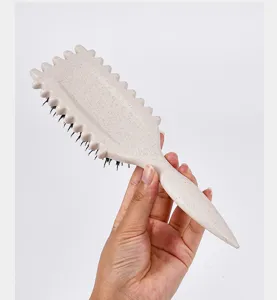 Wheat straw hair styling brush with unique wavy edge design for scalp massage and curls.
