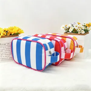 Colorful striped toiletry bag detail, portable travel makeup pouch with side handle.
