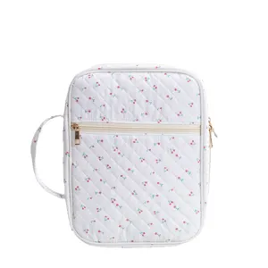 Bolsa de almacenamiento de libros acolchada blanca con diseño de cerezas, cremallera y asa.