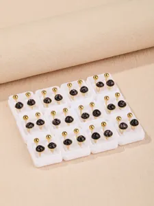 Stainless steel sparkly dome stud earrings set with white tray display presentation.