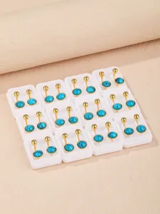 Detailed shot of gold-plated turquoise ball earring converters, neat display in small boxes.