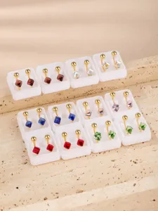 Detailed view of stainless steel square crystal ear clips and piercing converters in various colors.