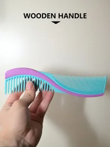 Close up detail of plastic hair comb with dual side teeth and wavy design in purple blue.