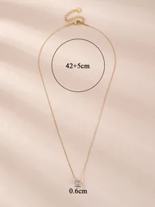 Close-up detail of the delicate titanium steel pendant necklace with sparkling cubic zirconia.