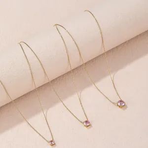 Elegant titanium steel birthstone necklace with sparkling pink cubic zirconia solitaire pendant for women.