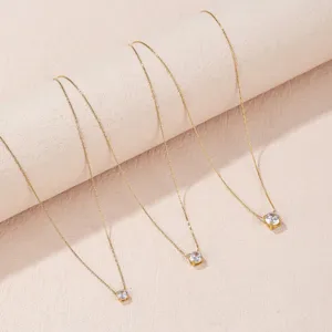 Elegant gold-plated titanium steel necklace featuring a sparkling solitaire cubic zirconia pendant.