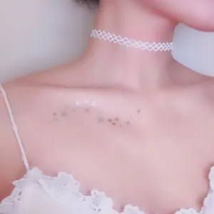 Waterproof gold foil star collarbone temporary tattoo sticker with elegant white lace choker.