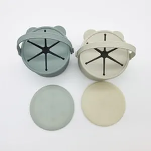 Silicone baby snack cup with bear ears, leak-proof star flap, and lid for toddlers feeding.