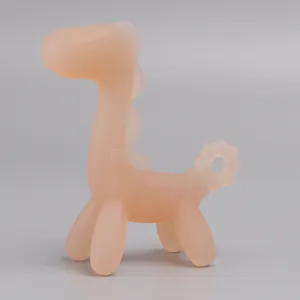 Close up view of the pink silicone baby teether toy detail, showing safe material and shape.