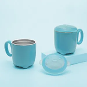 Blue silicone baby training cup with handle lid detail view, safe infant drinking mug.