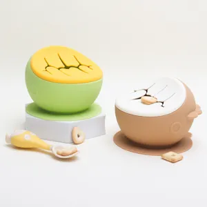Silicone baby snack bowl with suction base and spill-proof lid, toddler feeding training.