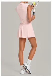 Pink sleeveless tennis dress detail, activewear pleated skirt with built-in shorts.