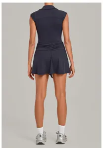 Back view of a dark grey activewear tennis dress, featuring a lapel collar and gathered waist.