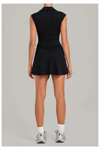 Back view of the black athletic tennis dress featuring a chic collar and ruched waist details.