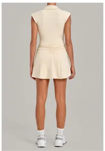 Back view details of women beige athletic tennis dress, sleeveless pleated activewear skirt.