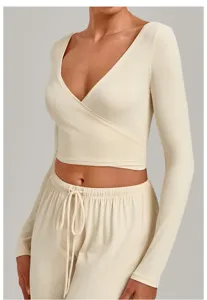 Beige wrap long sleeve yoga top with matching drawstring pants for fitness and exercise comfort.