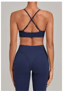 Back view detail of athletic yoga sports bra and high waist fitness leggings set.