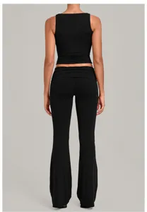 Black two piece yoga set activewear workout crop top and flare leggings with fold over waist