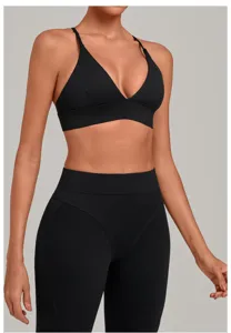 Detailed view of the black sports bra and high-waist yoga pants fitness activewear set.