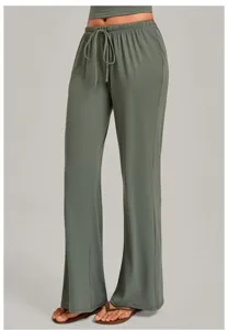 Grey wide-leg lounge pants detail showing comfortable elastic drawstring waist and relaxed fit.