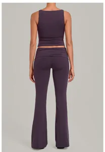 Solid purple yoga set featuring a backless tank top and fold-over waist flare fitness pants.