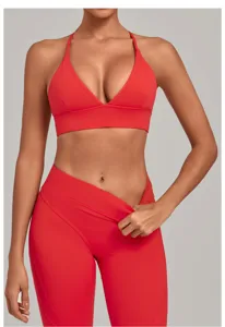 Red sports bra and leggings detail view, featuring quick-drying brushed fabric for active yoga workouts.