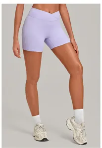 High waist crossover yoga shorts detail view, seamless activewear pants for running and fitness.